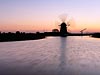 Molen t'Hoog en Groenland bij een winderige zonsondergang